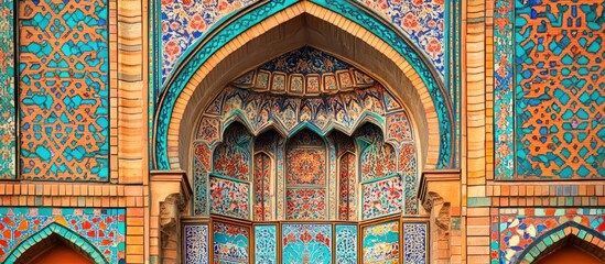 Obraz premium Ornate archway with intricate tile patterns in blue, green, and red colors.