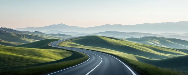 Winding road through rolling green hills under a clear sky.