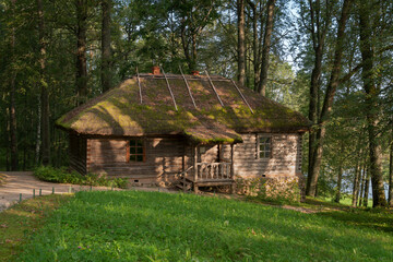 Traditional Russian log bathhouse in the Trigorskoye Estate of the Pushkin Natural Landscape Museum-Reserve on a sunny summer day, Pushkinskiye Gory, Pskov Region, Russia