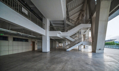 Stadium Interior with Multi-Level Staircases and Open Space