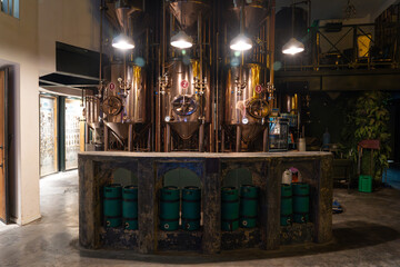 Rustic Industrial Bar Setup with Brewing Equipment and Vibrant Atmosphere