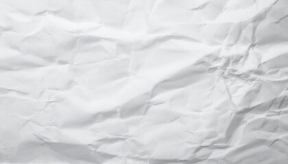 A close-up of crumpled white paper, showcasing a textured surface with shadows and highlights, ideal for backgrounds or artistic projects.