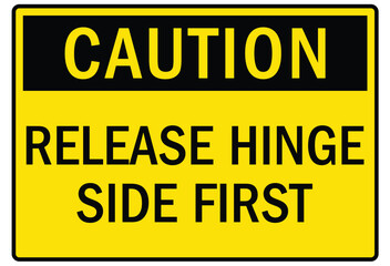 Truck safety warning sign release hinge side first