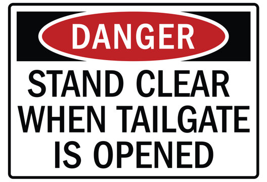 Truck safety warning sign stand clear when tailgate is opened
