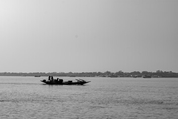 Country boat on river showcasing local life in Sundarban Tiger Reserve, India