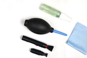 a set of camera lens cleaning tools isolated on white