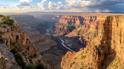 A dramatic canyon landscape with steep cliffs and a river winding - Powered by Adobe