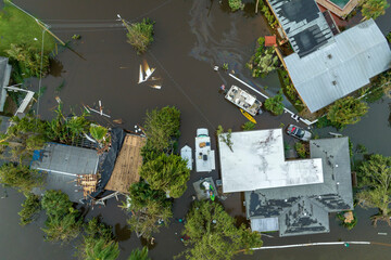 Consequences of natural disaster. Heavy flood with high water surrounding residential houses after...