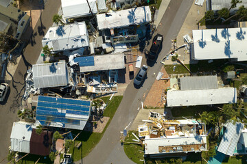 Destroyed by strong hurricane winds suburban houses in Florida mobile home residential area....