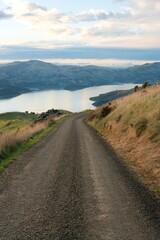 Scenic Road with Stunning Coastal View in Akaroa: A Breathtaking Drive