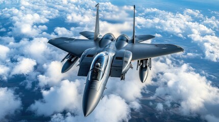 A gray fighter jet flies through the clouds on a sunny day.