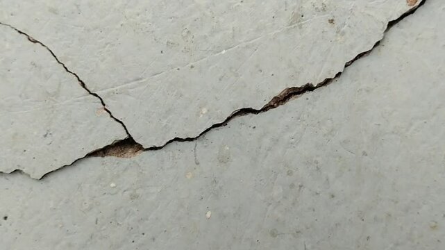 the house wall is cracked. The crack was caused by extreme weather