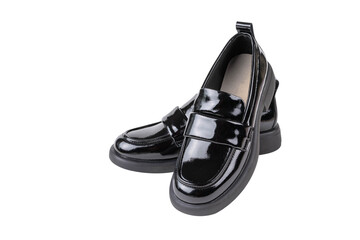 Shiny Black Loafers on Black Background Highlighting Modern Footwear Style