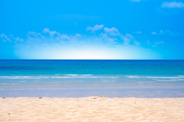 Nature of the beach and sea Summer with sunshine, sandy beaches, clear blue waters sparkling against the blue sky. On an island with good ecology and environment Background for summer vacation concept