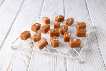 Cubes of salted caramel on a transparent tray