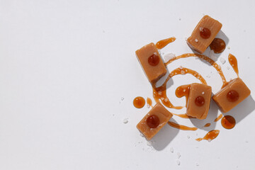 Cubes of salted caramel on a white background