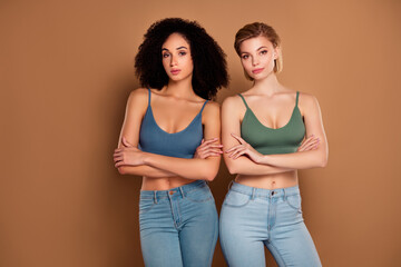 Photo of confident women wear top arms folded enjoying girl rights empty space isolated brown color background