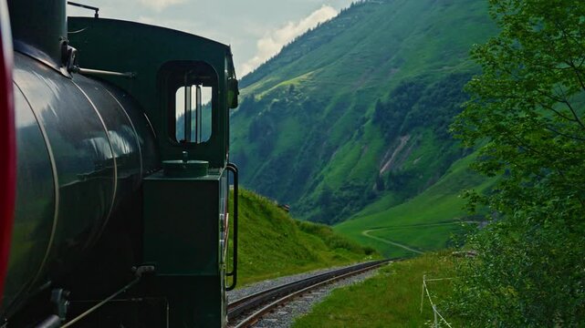 Train of cogwheel , tourist train, of Swiss alps and lake Brienz, Close up. Brienzer Rothorn