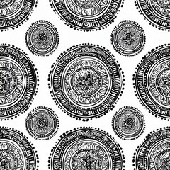 seamless pattern of mandala circles with paisley designs