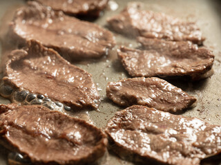Grilling steak on a griddle