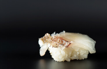 White fish sushi on a plate