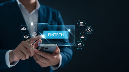 FinTech Financial Technology and Digital Banking, Businessman holding the word FinTech in his hand showing AI Online Banking, Digital Wallet and Digital Money, Online Finance On Application.