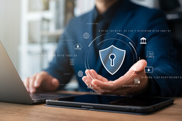 Cyber ​​security and internet data protection, businessman using laptop and tablet with padlock...