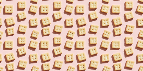 Obraz premium A seamless pattern of shortbread cookies, each with its shadow, scattered across the canvas in an elegant display, with soft shadows on a soft pale pink color background