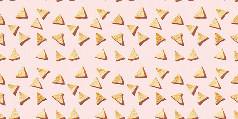 Obraz premium A seamless pattern of tortilla chips, each with its shadow, scattered across the canvas in an elegant display, with soft shadows on a soft pale pink color background