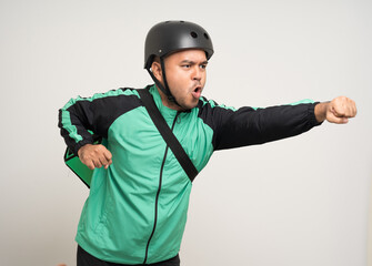 Young asian rider wearing green jacket uniform and bike helmet various action with delivery box. Male delivery service worker. Courier and shipping food service to customer online application