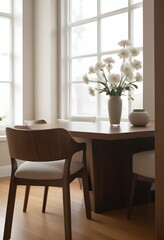 Fototapeta premium A cozy dining room with a wooden table and chairs, a vase of white flowers, and a framed artwork on the wall.