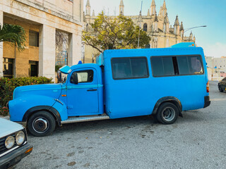 Large blue vintage truck parked outside a house in Vinales, Cuba. Many vintage vehicles are restored, converted into colectivos (local taxi) where different passengers ride together at the same time.