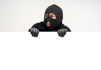 Thief in uniform black jacket various pose on isolated background. The Robber terrorism criminal escapes with balaclava and crowbar entering a house for stealing Housebreak