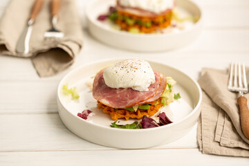 Sweet potato waffles with ham, avocado, lettuce and poached egg