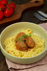 A plate of spaghetti pasta with meatballs