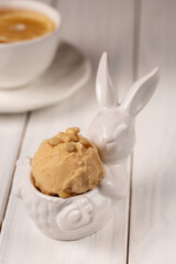 A ball of natural craft lemon ice cream with pine nuts.