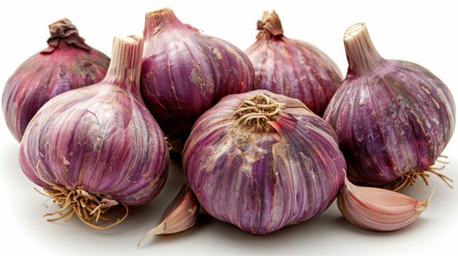 A group of six purple garlic bulbs with a single clove in front, isolated on a white background.