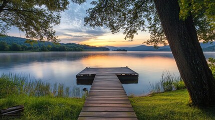 Wooden Dock on Tranquil Lake at Sunset