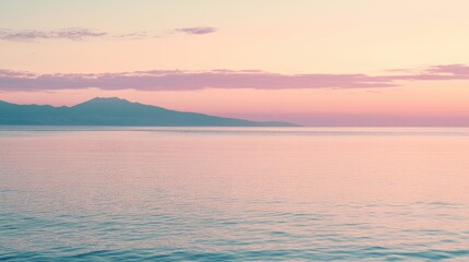 Fototapeta premium Serene Sunset Over Calm Water and Mountain Range