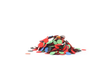 Colorful paper confetti red, black, green, white, blue closed up on white background