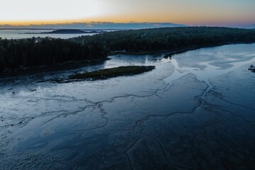 The Branch estuary and forest at sunrise, Phippsburg, Maine, United States.