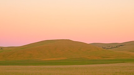 Fototapeta premium Serene Sunset Over Rolling Hills Perfect for Nature, Travel, and Landscape Designs Subtle Blur Background with Space for Custom Text