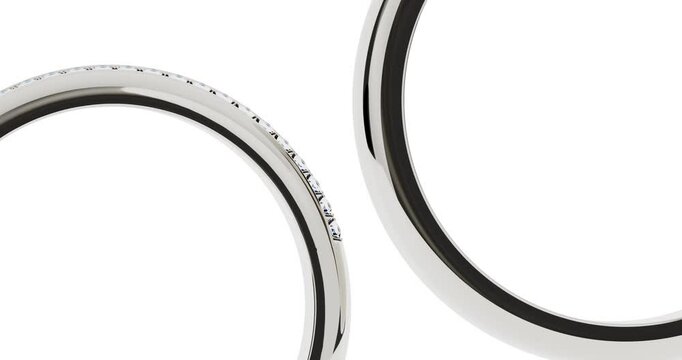 4k Resolution Video: Platinum Wedding Bands Diamond Ring Set Jewelry Seamless Loop Rotating on a White Background with Alpha Mate