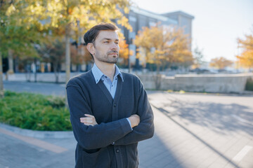 Thoughtful Professional Man Posing Confidently on a Bright Autumn Day