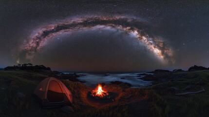 A tent and campfire under the Milky Way galaxy on a beach at night.