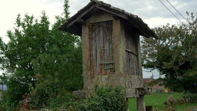 Wooden and stone h&oacute;rreo in a natural setting in Coles, Ourense, Galicia, Spain, used for storage