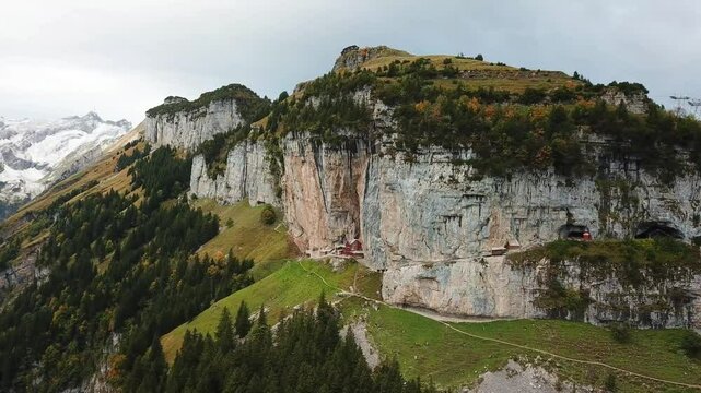 Ebenalp, Wildkirchli caves carved into a dramatic cliff face in the swiss alps, offering a unique blend of natural beauty packing a lot of interesting activities, &Auml;scher, Alpstein, Switzerland
