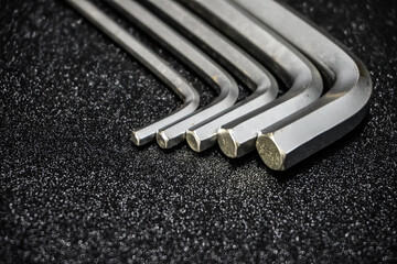 Allen Wrench on Black Background. L key isolated on black, tools, repair shop