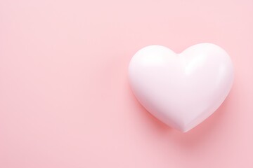 A simple heart-shaped object on a soft pink background for Valentine's Day