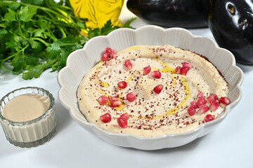 a plate with some food in it near other food and vegetables